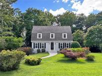 Charming home with a beautifully landscaped front yard and symmetrical dormer windows at 1625 Bill Murdock Rd, Marietta, GA 30062