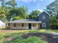 Charming two-story home with a covered porch and freshly landscaped front yard at 5310 Lyndale Cir, Forest Park, GA 30297