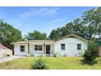 Charming single-story home featuring a brick facade and a well-maintained lawn at 2005 Simmons Ave, Atlanta, GA 30337