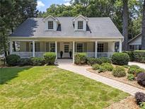 Charming home with a welcoming front porch and well-manicured lawn at 1772 Ridgewood Ne Dr, Atlanta, GA 30307