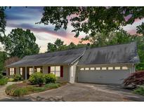 Charming home featuring a well-manicured front yard and a convenient two-car garage at 3122 Harmony Rd, Temple, GA 30179