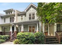 Charming townhome with a welcoming front porch, perfect for enjoying the outdoors at 106 Oakhurst Ter, Decatur, GA 30030