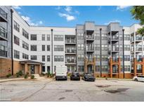 Modern building with multiple units, each featuring private balconies and convenient parking at 898 Oak Sw St # 3228, Atlanta, GA 30310