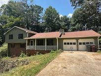 Charming two-story house featuring a two-car garage and front porch at 504 Tracy Ct, Lawrenceville, GA 30046