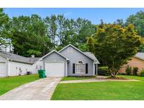 Charming single-story home with a well-manicured lawn and inviting curb appeal at 3163 Springside Xing, Decatur, GA 30034