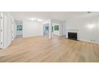 Bright living room boasts natural light, fireplace, and light-toned floors, creating an inviting and airy atmosphere at 22 Dunwoody Springs Dr # 22, Atlanta, GA 30328