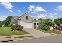 Charming home with a two-car garage and well-maintained landscaping at 3804 Tattenhall Drive Dr, Cumming, GA 30040