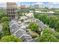 Expansive aerial view of community shows lush landscaping, city views and ample parking at 3655 Habersham Road Northeast Ne Rd # B249, Atlanta, GA 30305