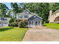 Charming two-story home with a well-maintained lawn and two-car garage at 2368 Glynn Se Dr, Atlanta, GA 30316