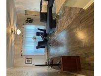 Modern living room with a blue sofa, wood floors, and stylish décor at 4333 Dunwoody Park, Atlanta, GA 30338