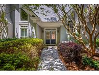 Inviting front entrance featuring a double door framed by lush landscaping at 410 Waterridge Ct, Sandy Springs, GA 30350