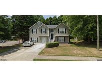 Charming two-story home with black shutters, a well-manicured lawn, and an extended driveway in a lush neighborhood at 2153 Dresden Nw Grn, Kennesaw, GA 30144