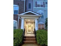 Welcoming front entrance with covered porch and well-maintained landscaping at 1955 Nocturne Dr # 3105, Alpharetta, GA 30009