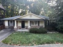 Charming single story home featuring a welcoming front porch and brick accents at 2713 Valvedere Ne Dr, Atlanta, GA 30319