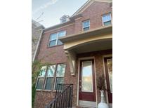 Charming two-story brick home featuring a covered front entry and large, bright windows at 1749 Breyerton Ne Dr, Atlanta, GA 30329