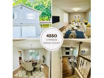 Charming two-story home with a well-manicured lawn and a two-car garage at 4550 Cypress Ridge Ct, Stone Mountain, GA 30083