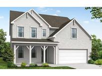 Charming two-story home featuring a welcoming front porch and an attached two-car garage at 6945 Melody Ridge Rd, Buford, GA 30518