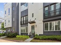 Beautiful townhome with manicured landscaping and striking architectural details at 704 Banton Nw Dr, Atlanta, GA 30318