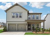 Charming two-story home with a two-car garage and landscaped front yard at 1001 Starmoss Ln, Conyers, GA 30094