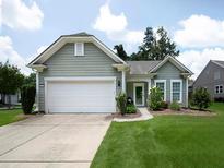 Charming single-story home with a well-manicured lawn, attached two-car garage, and inviting curb appeal at 2871 Goldfinch Cir, Marietta, GA 30066