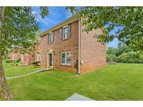 Charming brick home with a well-maintained lawn, offering a classic and inviting curb appeal at 4691 Shumate Dr, Stone Mountain, GA 30083