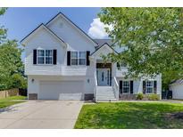 Charming two-story home with white siding, black shutters, and a well-maintained front yard at 3153 Morgan Box Ne Ln, Buford, GA 30519