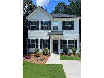 Charming two-story home with white siding, black shutters, and manicured front yard, perfect for Gathering living at 5350 Mercedes Dr, Cumming, GA 30041