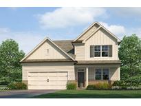 Charming two-story home featuring a two-car garage, manicured lawn, and classic architecture at 910 Sundown Pt, Villa Rica, GA 30180