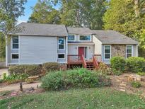 Charming two-story home with a welcoming front porch and beautiful landscaping at 2653 Partridge Trl, Duluth, GA 30097