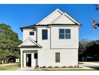 Charming two-story home featuring a white exterior and black accents at 12 Confederate Nw St, Cartersville, GA 30121