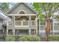 Charming condo with covered balcony, well-maintained landscaping and a black fence at 578 Mcgill Ne Pl # 578, Atlanta, GA 30312