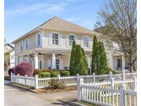 Charming two-story home with white picket fence and manicured landscaping at 1370 Dupont Nw Park, Atlanta, GA 30318