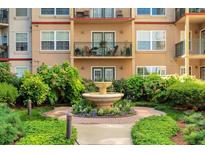 Attractive condominium exterior with fountain, beautiful landscaping and multiple balconies at 230 E Ponce De Leon Ave # 116, Decatur, GA 30030