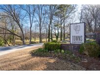 A well-manicured entrance sign for 'Towns at North Decatur' welcomes visitors into the community at 852 Constellation Dr, Decatur, GA 30033