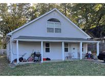 Charming single Gathering home with a covered front porch and a well maintained yard at 4004 Campbellton Rd, Atlanta, GA 30331
