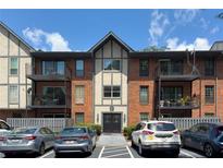 Attractive condo with brick and painted facade, and upper level units with balconies at 6851 Roswell Rd # F5, Sandy Springs, GA 30328