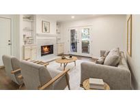 Inviting living room featuring a cozy fireplace and bright french doors at 1150 Collier Nw Rd # A1, Atlanta, GA 30318