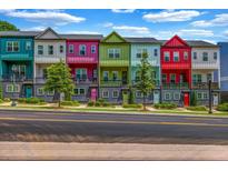 Charming colorful townhomes featuring unique architectural details, balconies, and well-maintained landscaping at 2022 Bixby Byway Se Rd, Atlanta, GA 30317