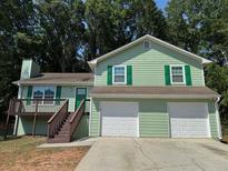 Charming two-story home with a two-car garage and a deck at 110 Stagecoach Trl, Stockbridge, GA 30281
