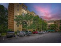 Spacious, modern condo building with assigned parking surrounded by mature shade trees at 1800 Clairmont Lk # A310, Decatur, GA 30033