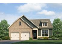 Charming home featuring a two-car garage, brick accents, and a well-manicured lawn at 304 Cedar Hollow Dr Ln, Conyers, GA 30094
