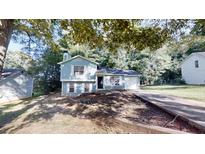 Charming two-story home with a well-maintained lawn and a classic, inviting facade at 3457 Newberry Trl, Decatur, GA 30034