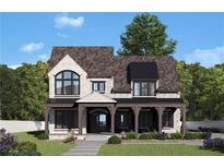 Charming two-story home with beautiful white brick, a covered porch, and lush landscaping at 245 Heatherton Way, Milton, GA 30009