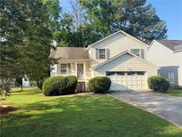 Charming home featuring a well-manicured lawn and inviting front porch at 2765 Dahlonega Trl, Austell, GA 30106