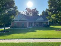 Charming single story home with well maintained front lawn at 969 Golden Meadows Ln, Loganville, GA 30052