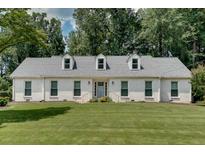 Charming single-story home with a gray roof, dormer windows, and a manicured front lawn at 2936 Randolph Ne Rd, Atlanta, GA 30345