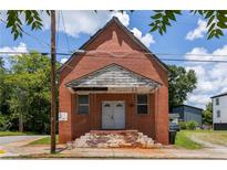 Unique brick building with a covered entryway and potential for renovation at 88 Martin Se Ave, Atlanta, GA 30315