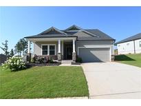 Charming single-Gathering home with a well-manicured lawn and inviting curb appeal at 1057 Towne Mill Xing, Canton, GA 30114