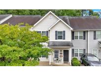 Charming two-story townhome with well-maintained lawn and inviting entrance at 261 Venture Path, Hiram, GA 30141
