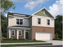 Two-story home showcasing brick facade, vertical siding, and an attached two-car garage at 109 Bandimere Pkwy, Dallas, GA 30157